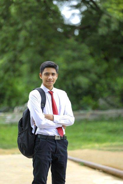 handsome indian young boy wearing white shirt and red tie premium photo